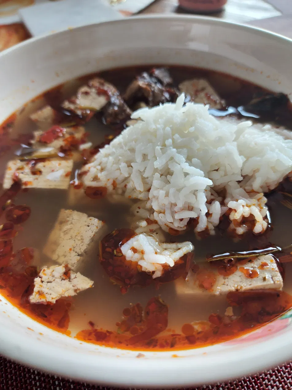 Warming soup bowl with rice and soft tofu