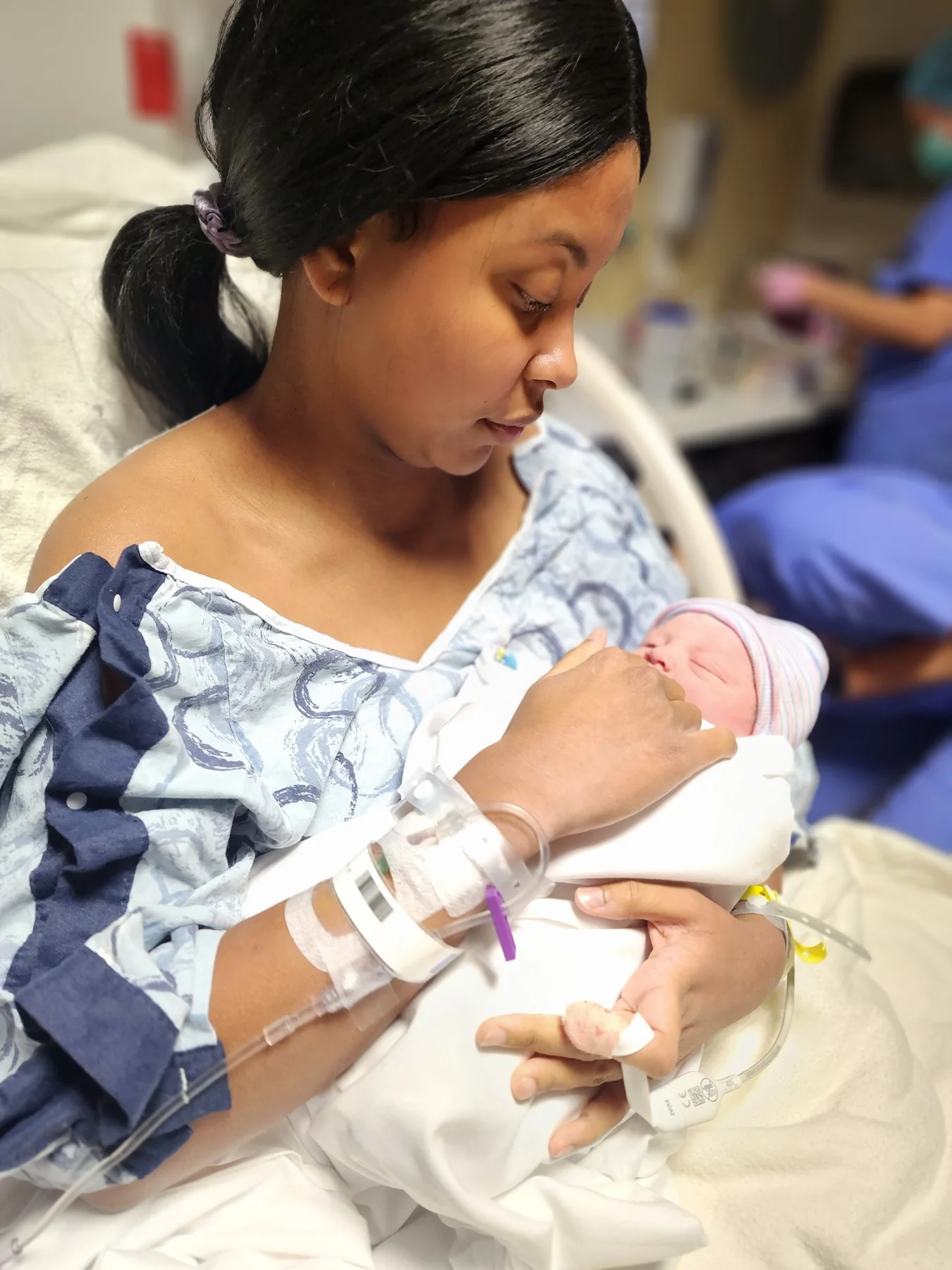 Mother gazing at her newborn in the hospital