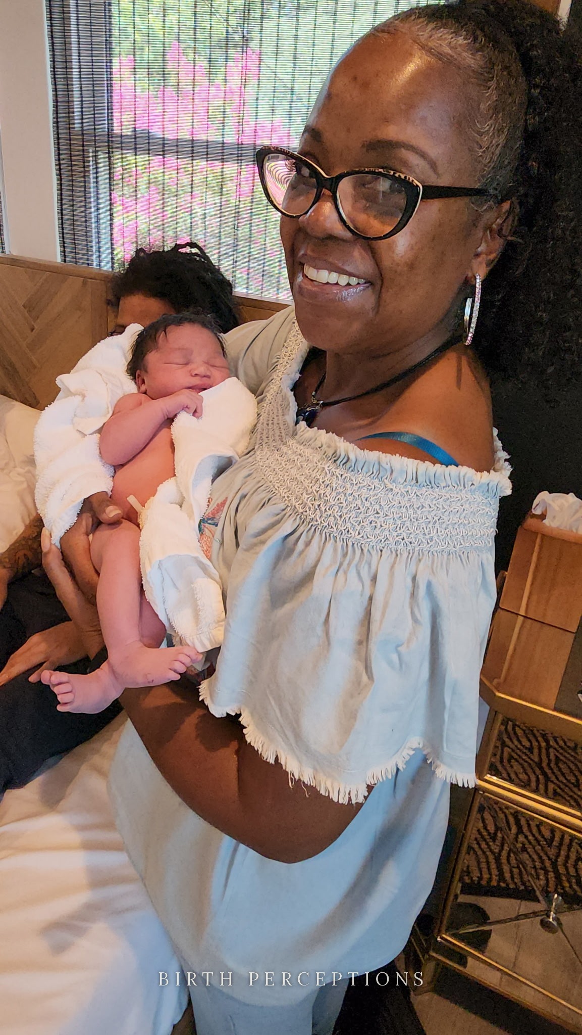 Grandmother holding newborn