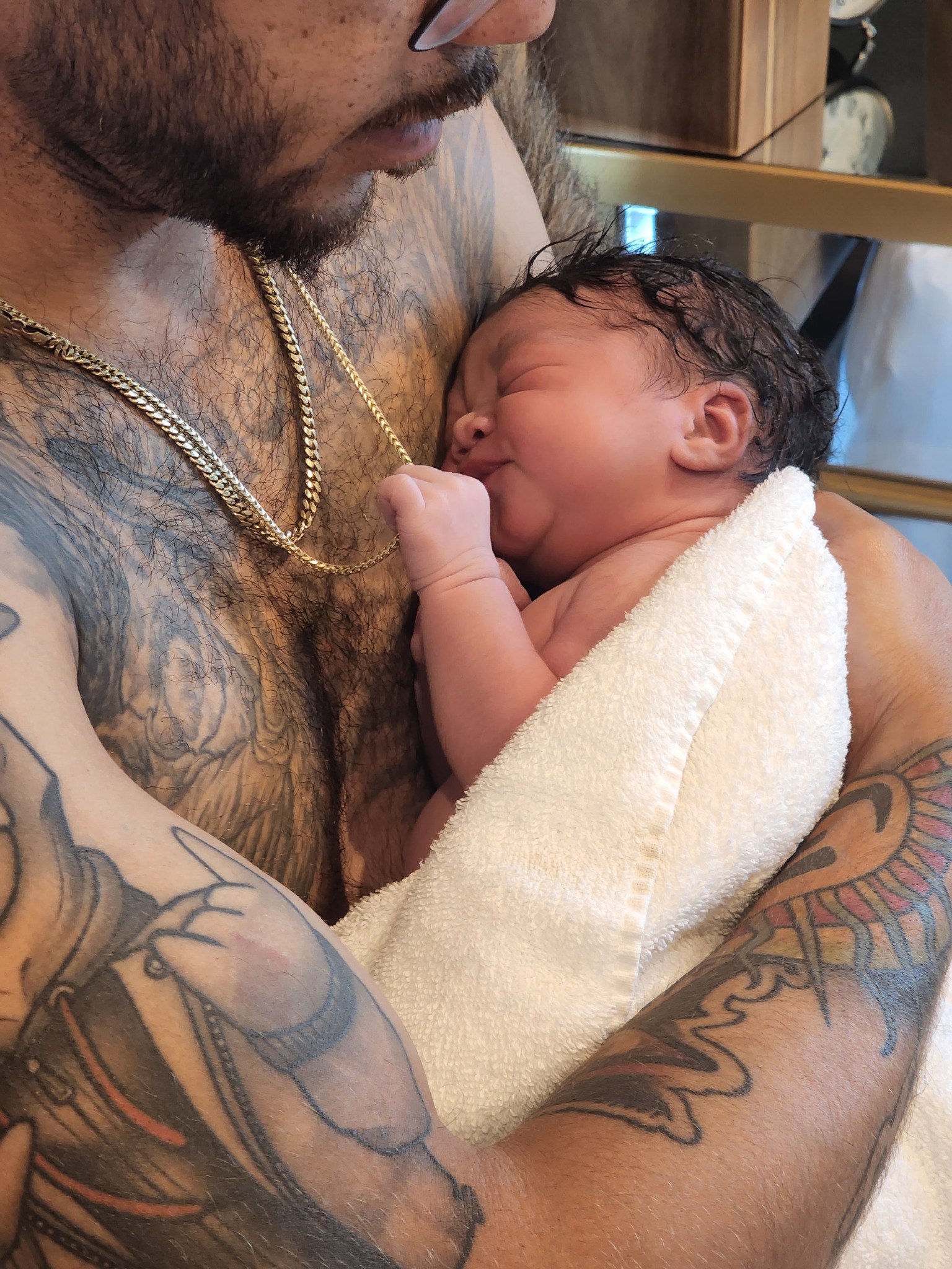 Skin to skin newborn care with father